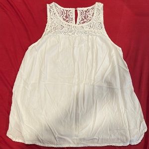 White flowy tank top. With design on top.